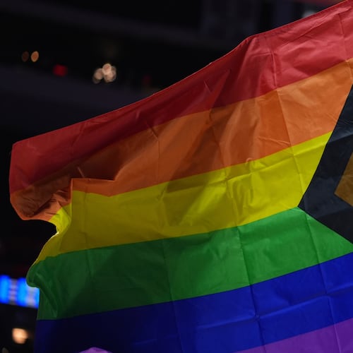 FILE - A pride flag is waved during an NBA basketball game in Philadelphia on Sunday, March 30, 2025. (AP Photo/Matt Slocum, File)