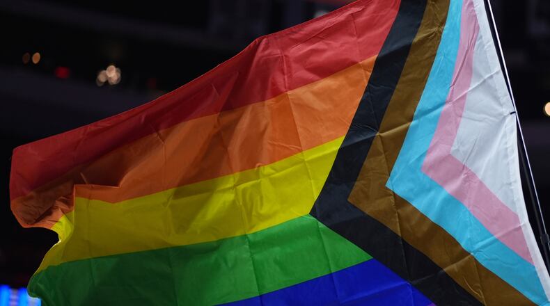 FILE - A pride flag is waved during an NBA basketball game in Philadelphia on Sunday, March 30, 2025. (AP Photo/Matt Slocum, File)