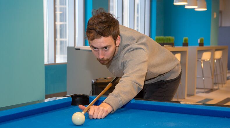 Hays Hopkins plays billiards during a break at the SalesLoft offices in Atlanta on February 2nd, 2018. For story in the AJC Top Workplaces section.  (Photo by Phil Skinner)