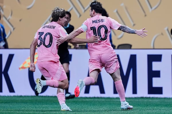 Inter Miami's Benjamin Cremaschi, left, and Lionel Messi celebrate after a goal during the Club World Cup group A soccer match between Inter Miami and FC Porto in Atlanta, Thursday, June 19, 2025. (AP Photo/Mike Stewart)