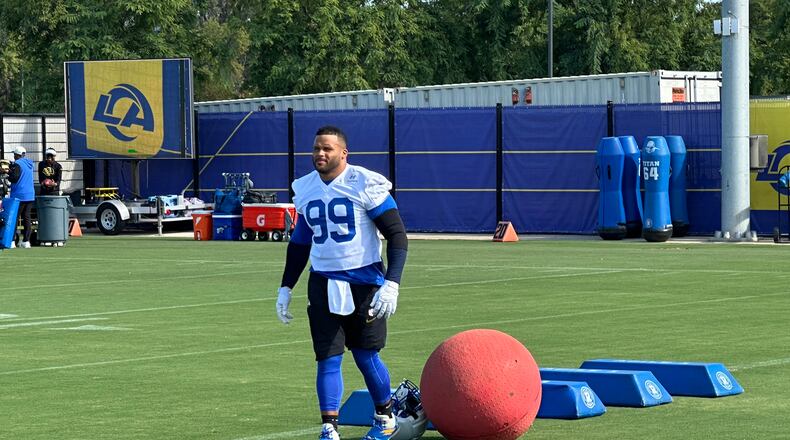 Aaron Donald takes the field for practice at the Los Angeles Rams' training complex in Los Angeles, Sunday, Aug. 30, 2026. (AP Photo/Greg Beacham)