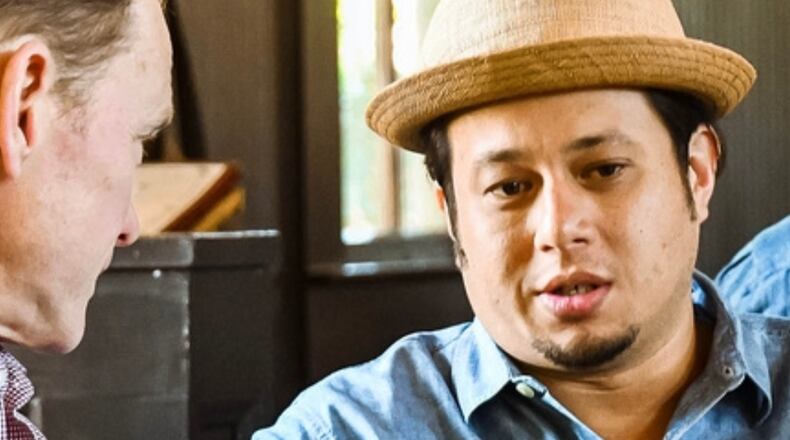 Compass Box founder John Glaser and restaurateur Eric Simpkins (right) talk cocktails. Simpkins started out as a bartender. Courtesy of Laura Baccus