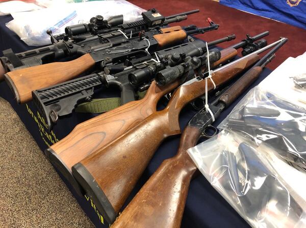Authorities said several guns were seized when 20 people were arrested in Atlanta for allegedly trafficking methamphetamine.