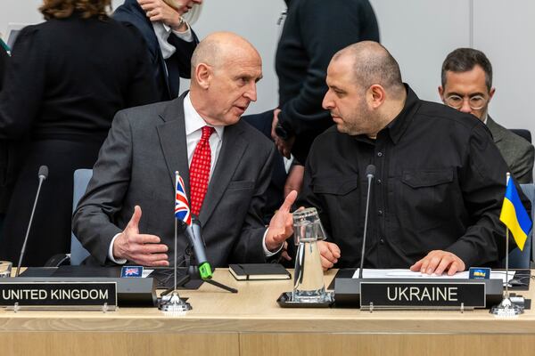 Britain's Defense Secretary John Healey, left, talks with Ukraine's Defense Minister Rustem Umerov during a meeting of the Ukraine Defence Contact Group at NATO headquarters in Brussels, Friday, April 11, 2025. (AP Photo/Geert Vanden Wijngaert)
