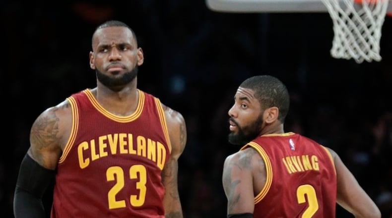 In this March 19, 2017, file photo, Cleveland Cavaliers' LeBron James, left, greets Kyrie Irving during the second half of an NBA basketball game against the Los Angeles Lakers in Los Angeles. Irving was traded to the Bostons Celtics and returns to Cleveland to play against the Cleveland Cavaliers Tuesday. (AP Photo/Jae C. Hong, File)