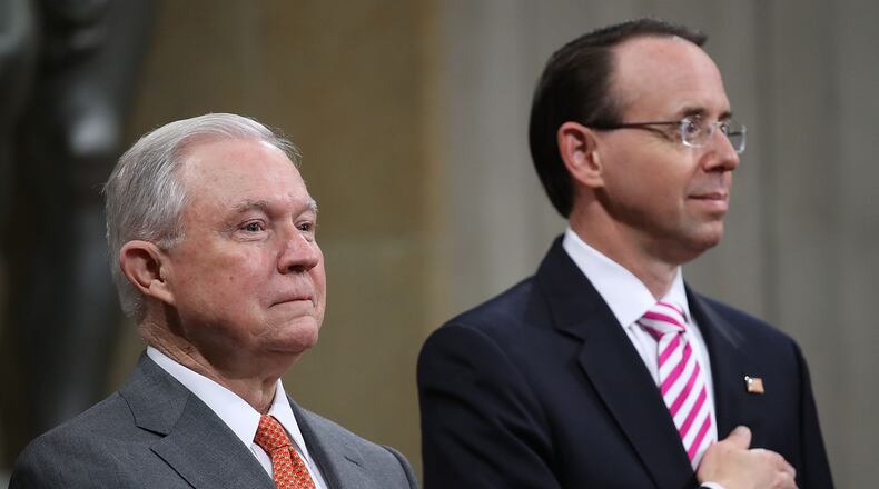 Attorney General Jeff Sessions (L) and Deputy Attorney General Rod Rosenstein (R) attend the Religious Liberty Summit at the Department of Justice July 30, 2018 in Washington, D.C.