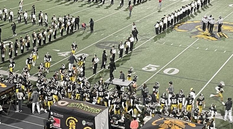 Carrollton players take the field before their Class 6A quarterfinal game on Nov. 26, 2021, at Grisham Stadium in Carrollton. The Trojans defeated Westlake 37-32.