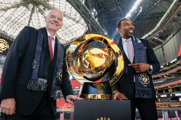 Atlanta’s Mayor Andre Dickens and FIFA President Gianni Infantino pose with the FIFA Club World Cup trophy after a press conference at Mercedes-Benz Stadium on Monday, April 14, 2025, to discuss the upcoming 2025 Club World Cup, which will be hosted in Atlanta this summer. 
(Miguel Martinez/ AJC)