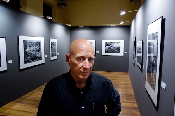 FILE - Brazilian photographer Sebastiao Salgado poses for a photo at his exhibit in the Artes e Oficios Museum of Belo Horizonte, Brazil, Oct. 26, 2006. Salgado, known for his long-term projects and images of nature and humanity, died at age 81, the Instituto Terra confirmed on Friday, May 23, 2025. (AP Photo/Eugenio Savio)