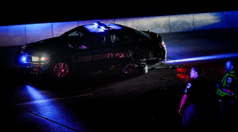 The driver of a 2021 Honda Accord was arrested after Cobb County police said he hit two patrol cars and injured two officers.