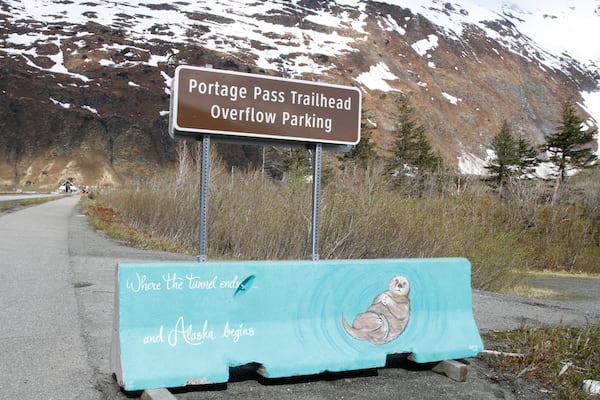 A sign is displayed along the road in Whittier, Alaska, on May 13, 2025, that says "Where the tunnel ends and Alaska begins." (AP Photo/Mark Thiessen)