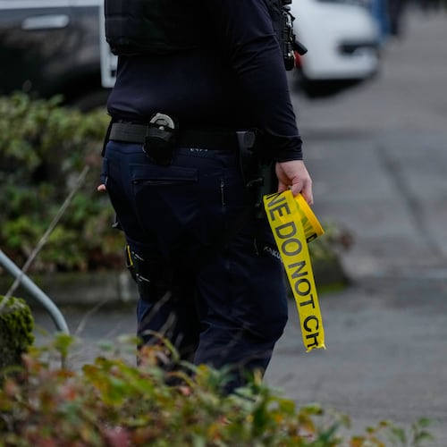 Law enforcement officials work the scene following reports that federal immigration officers shot and wounded people in Portland, Ore., Thursday, Jan. 8, 2026. (AP Photo/Jenny Kane)