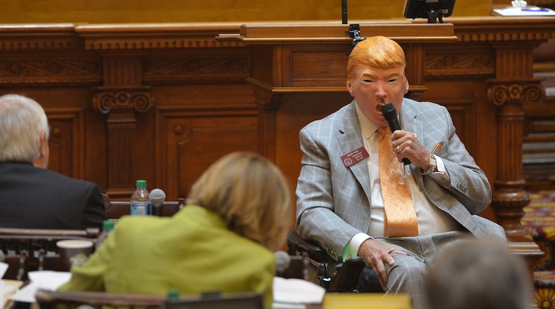 March 24, 2016 Atlanta: Rep. Rusty Kidd wears a Donald Trump mask as he addresses the House during morning orders on the final day of the session Thursday March 24, 2016. BRANT SANDERLIN/BSANDERLIN@AJC.COM