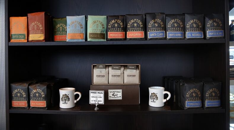 Coffee beans and cups on sale in a display inside Stumptown Coffee Roasters, which opened in December in the Ace Hotel in Chicago's West Loop across from Google headquarters.  (Nancy Stone/Chicago Tribune/TNS)