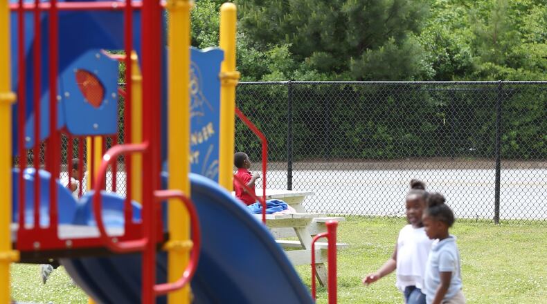 Children play on the playground at Dobbs Elementary School in Atlanta on Wednesday, May 1, 2019. Atlanta Public Schools closed playgrounds in the spring amid the pandemic but plans to reopen them. EMILY HANEY / AJC FILE PHOTO