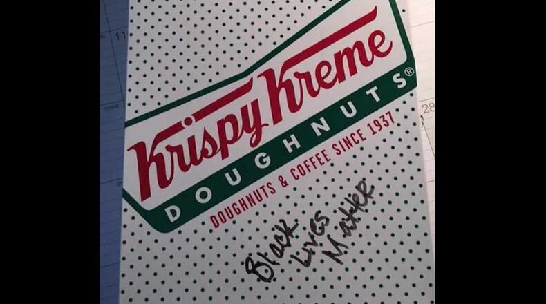 An image, posted by pro-police blog Blue Lives Matter, supposedly of a Krispy Kreme doughnut box received by a Smyrna police officer ordering from the South Cobb Drive location.