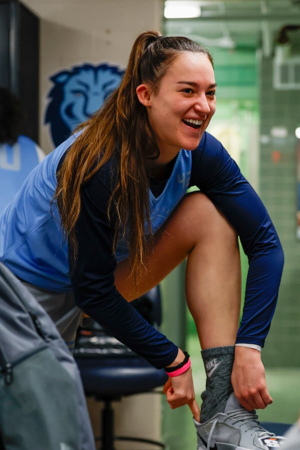 Columbia forward Blau Tor puts on her shoes for practice at Carmichael Arena on the campus of the University of North Carolina in Chapel Hill, N.C., Wednesday, March 19, 2025, before their First Four basketball game in the NCAA Tournament against Washington on March 20. (AP Photo/Nell Redmond)
