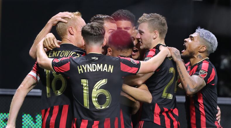 August 14, 2019 Atlanta: Atlanta United captain Jeff Larentowicz (far left) is mobbed by teammates after scoring a goal to tie the game 2-2 with Club America in the Campeones Cup on Wednesday, August 14, 2019, in Atlanta. Curtis Compton/ccompton@ajc.com