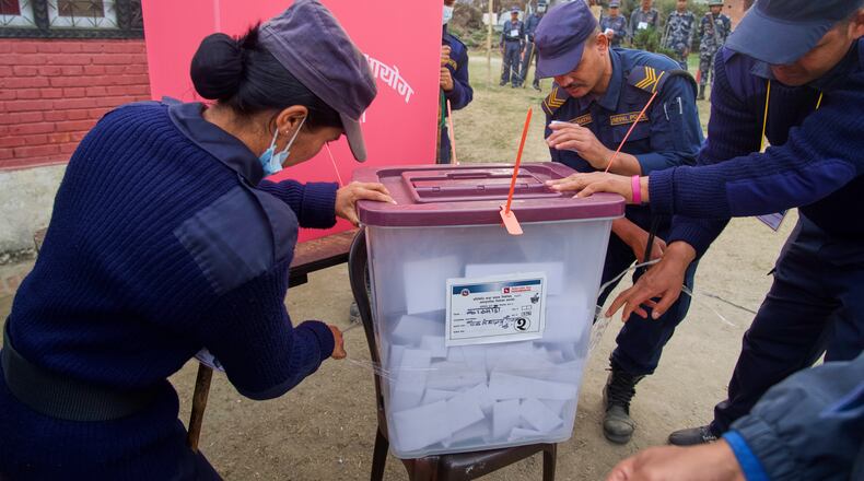 Police personals close the ballot box at the end of the polling during the parliamentary election in Kathmandu, Nepal, Thursday, March 5, 2026. (AP Photo/Niranjan Shrestha)