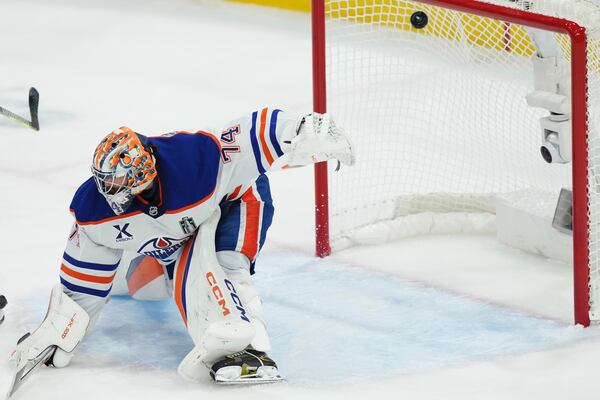Edmonton Oilers goalie Stuart Skinner (74) is scored on by Florida Panthers' Sam Bennett, not shown, during the second period in Game 3 of the NHL hockey Stanley Cup finals in Sunrise, Fla., Monday, June 9, 2025. (Nathan Denette/The Canadian Press via AP)