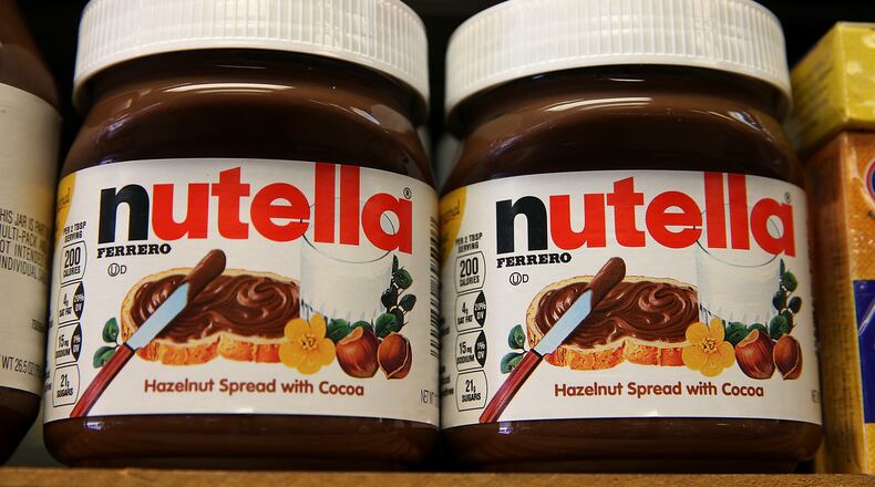 Jars of Nutella on store shelves.