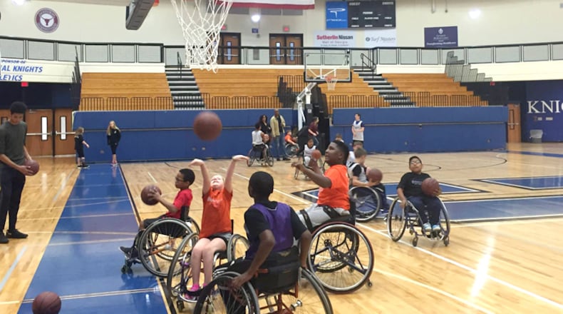 The BlazeSports Junior Hawks practice at Centennial High School, Roswell. The city’s recreation department has been recognized for its work with physically and developmentally disabled children and adults. BLAZESPORTS