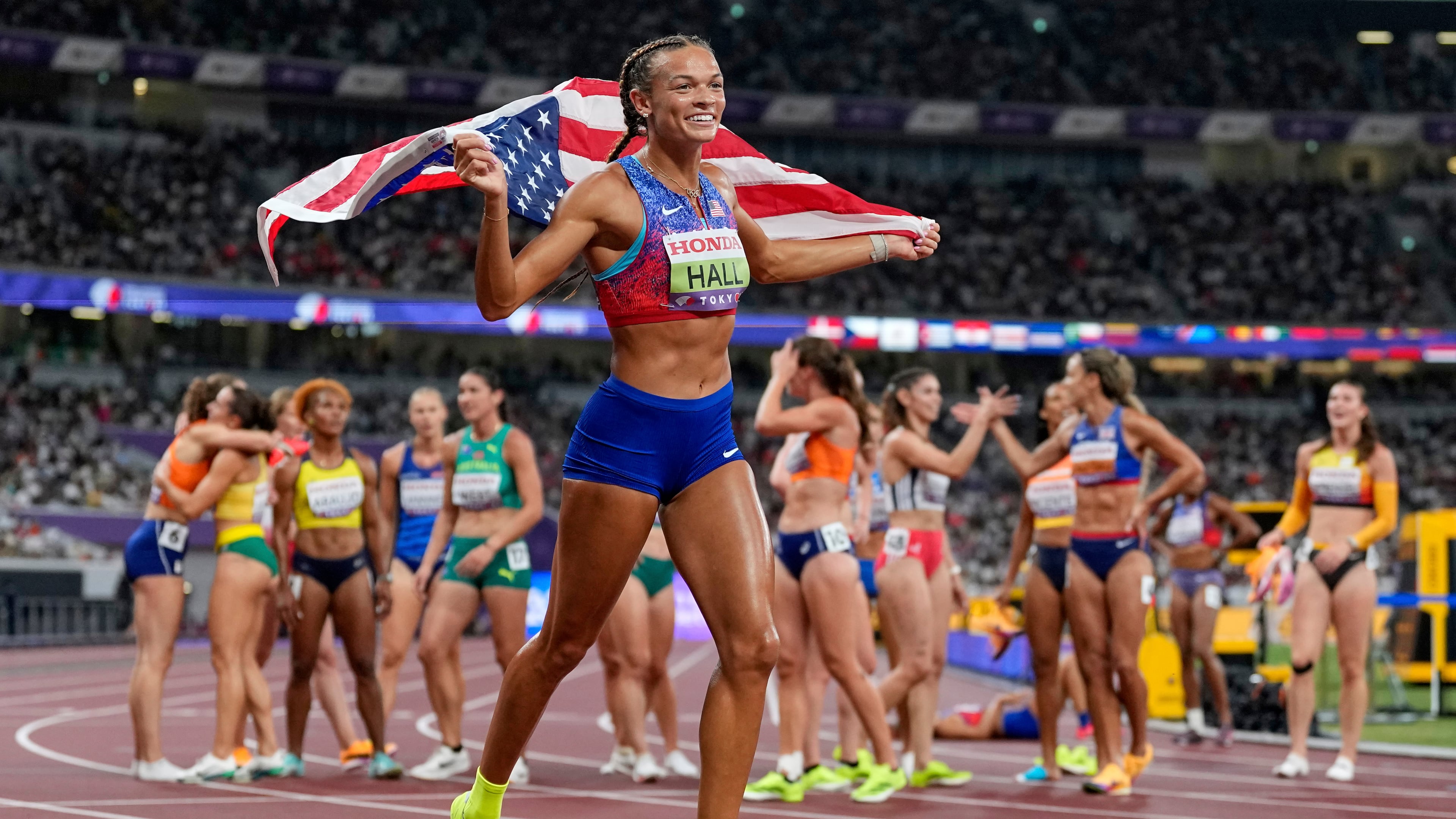 United States' Anna Hall celebrates after wining the gold in the heptathlon at the World Athletics Championships in Tokyo, Saturday, Sept. 20, 2025. (AP Photo/Petr David Josek)