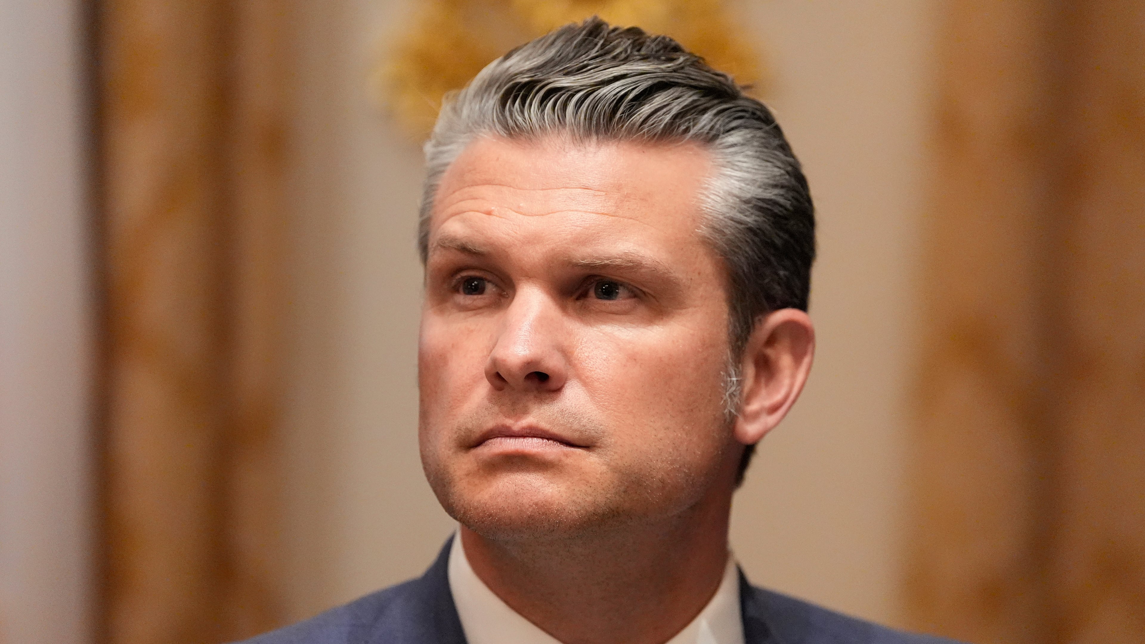 Defense Secretary Pete Hegseth listens as President Donald Trump speaks before a lunch with Ukraine's President Volodymyr Zelenskyy in the Cabinet Room of the White House, Friday, Oct. 17, 2025, in Washington. (AP Photo/Alex Brandon)