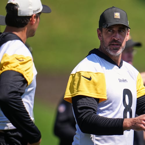 Pittsburgh Steelers quarterbacks Aaron Rodgers (8) and Mason Rudolph, left, discuss a play during the team's NFL football training camp in Latrobe, Pa., on Friday, July 31, 2026. (Gene J. Puskar/AP)