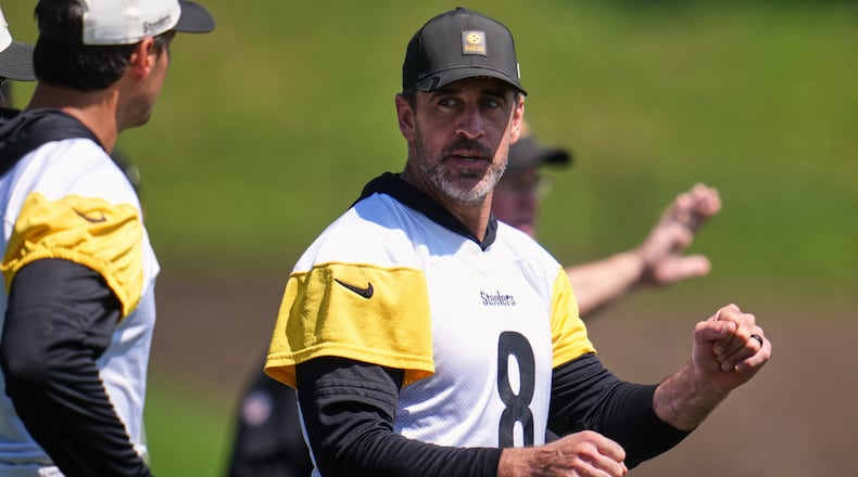Pittsburgh Steelers quarterbacks Aaron Rodgers (8) and Mason Rudolph, left, discuss a play during the team's NFL football training camp in Latrobe, Pa., on Friday, July 31, 2026. (Gene J. Puskar/AP)