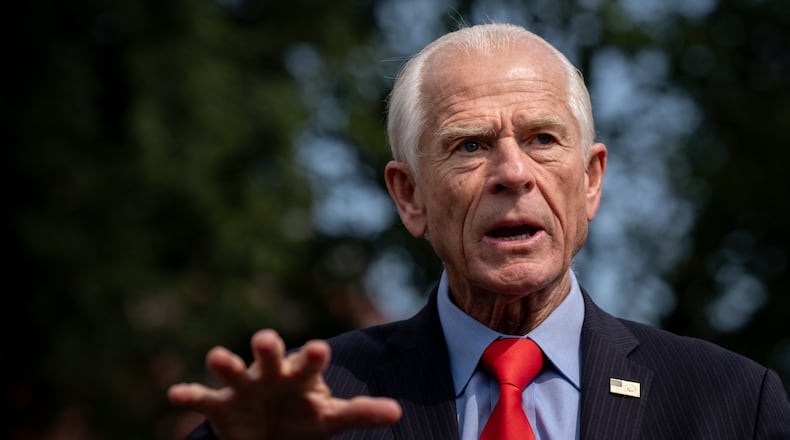 White House trade counselor Peter Navarro speaks with reporters following a video interview with Real America's Voice News, Tuesday, Aug. 11, 2026, outside the White House in Washington. (AP Photo/Julia Demaree Nikhinson)