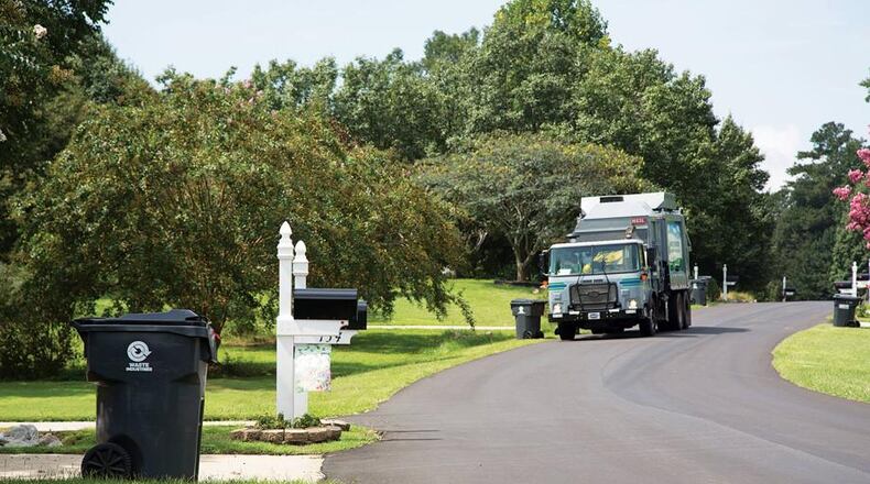 Peachtree City does not allow residential trash collection companies to charge extra for recycling pickup. AJC file photo