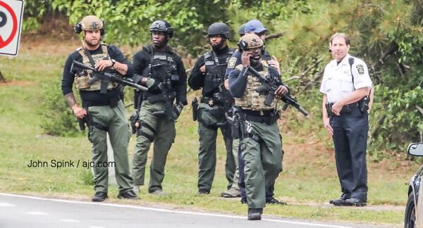Officers from several jurisdictions have responded to a Stockbridge home where two officers were shot Thursday morning.
