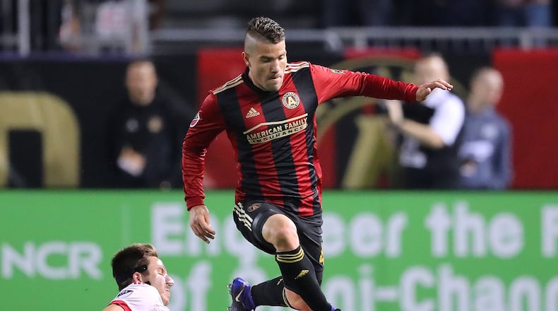 Atlanta United’s Greg Garza makes a move past N.Y. Red Bulls defender Alex Muyl during the first half of their first game in franchise history, March 5. (Curtis Compton/ccompton@ajc.com)