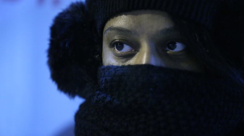 An early-morning commuter faced low temperatures with a wind-chill near zero on Friday morning in downtown Atlanta.