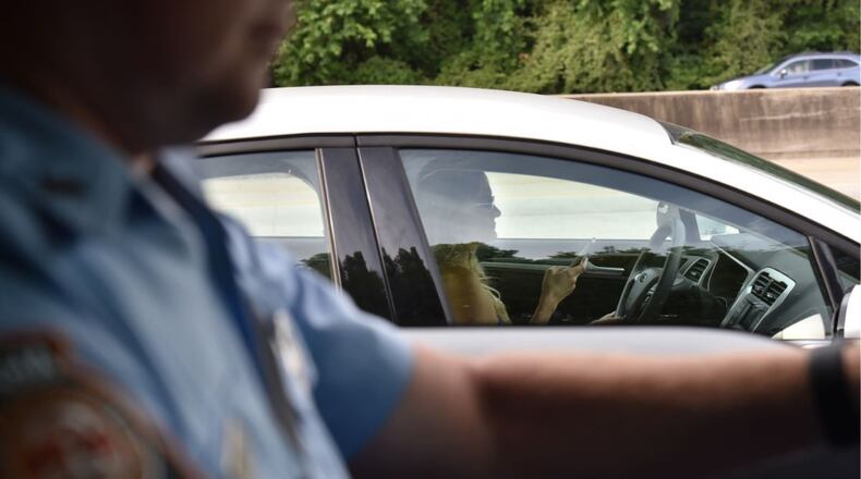 Early evidence suggests stepped-up enforcement and publicity about Georgia’s new distracted-driving law has changed the behavior of some drivers. (HYOSUB SHIN/HSHIN@AJC.COM)