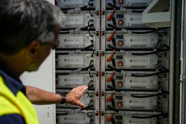 Craig Horne, vice president of advanced energy solutions for Energy Vault, a company that is creating an emergency power system that relies on hydrogen and battery storage, shows a battery system Tuesday, May 27, 2025, in Calistoga, Calif. (AP Photo/Annika Hammerschlag)