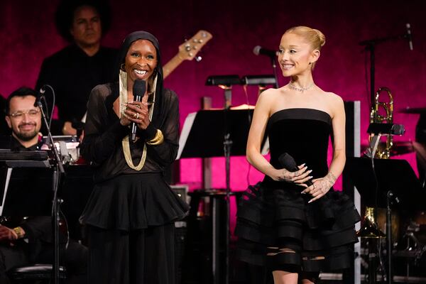 Cynthia Erivo, left, and Ariana Grande, cast members of the upcoming film "Wicked: For Good," speak during the Universal Pictures and Focus Features presentation at CinemaCon on Wednesday, April 2, 2025, at Caesars Palace in Las Vegas. (AP Photo/Chris Pizzello)