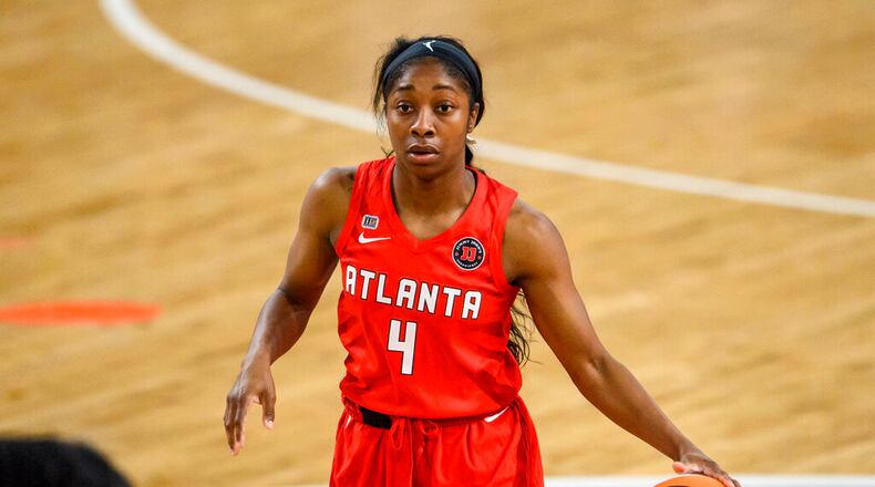 Dream guard Aari McDonald (4) in action during a WNBA basketball game against the Dallas Wings, Thursday, May 27, 2021, in College Park, Ga. (AP Photo/Danny Karnik)
