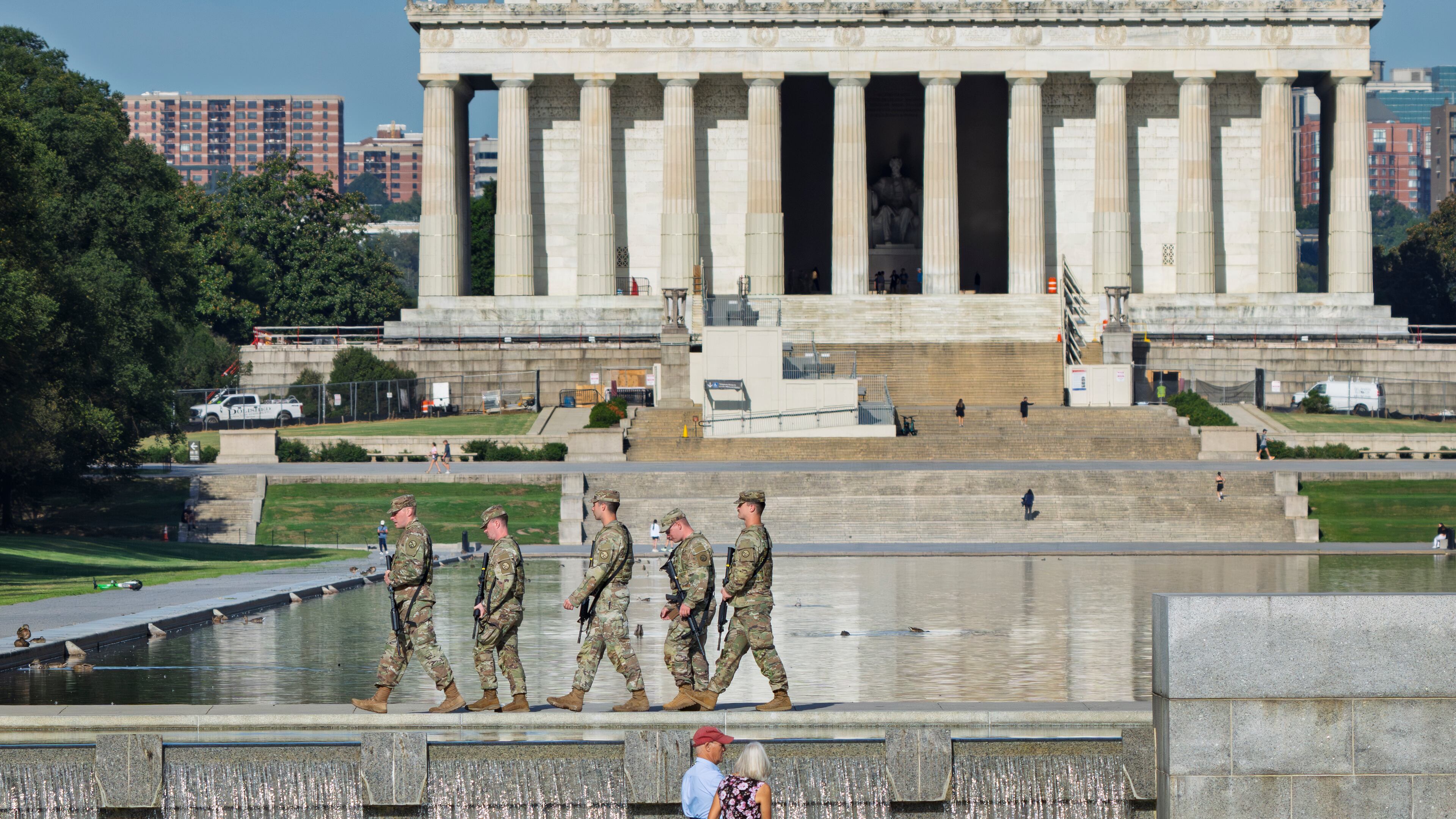 National Guard troops patrol the Mall near the Lincoln Memorial on Aug. 28 as part of President Donald Trump's order to impose federal law enforcement in the nation's capital. (J. Scott Applewhite/AP)