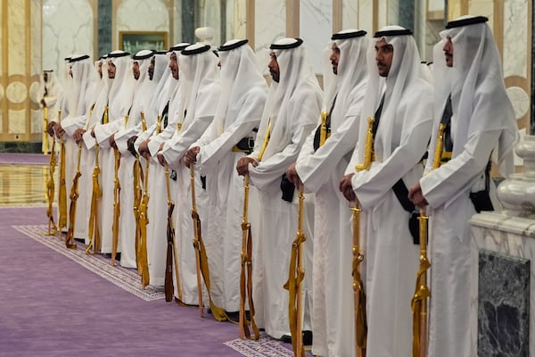 Members of a traditional Saudi honor guard with their golden swords wait for the arrival of President Donald Trump and Saudi Crown Prince Mohammed bin Salman during an arrival ceremony at the Royal Palace in Riyadh, Saudi Arabia, Tuesday, May 13, 2025. (AP Photo/Alex Brandon)