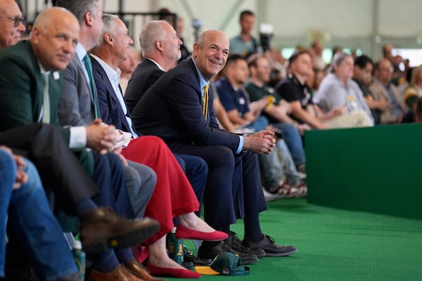 Athletics owner John Fisher, center, listens during a groundbreaking ceremony for the Athletics' baseball stadium Monday, June 23, 2025, in Las Vegas. (AP Photo/John Locher)