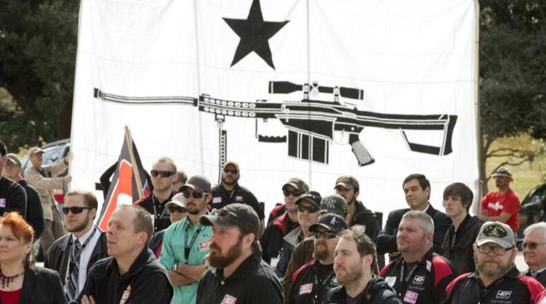 Gun rights activists listen during the Open Carry Texas "Carry to the Capitol" rally for HB 195, the open carry bill, at the Capitol on Monday January 26, 2015.