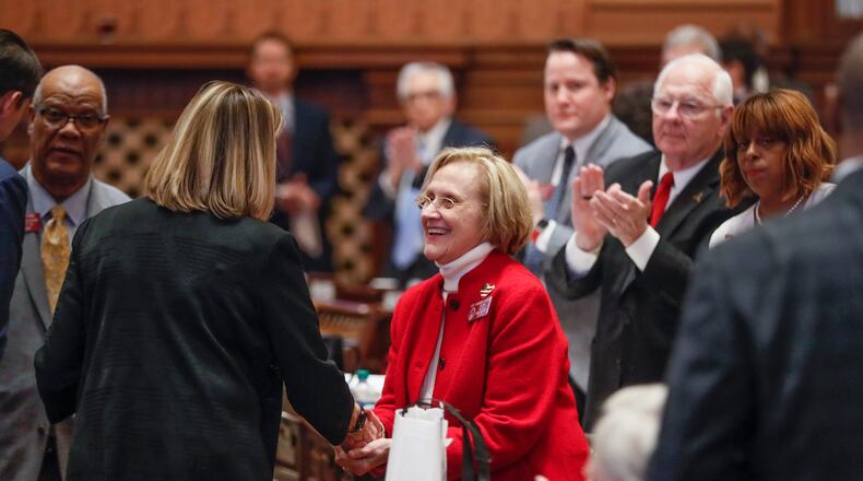 February 28, 2020 - Atlanta - Rep. Sharon Cooper (center),
R - Marietta, receives a standing ovation and  is congratulated by Speaker Pro-Tempore Jan Jones, R - Milton, after the passage of her bill.  The Georgia house passed  HB 987,  sponsored by Cooper, to provide additional measures for the protection of elderly persons and better regulate assisted living facilities.  Bob Andres / robert.andres@ajc.com