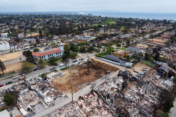 The land, center, where Community United Methodist Church of the Pacific Palisades once stood, Friday, April 18, 2025, in the Pacific Palisades area of Los Angeles. (AP Photo/William Liang)
