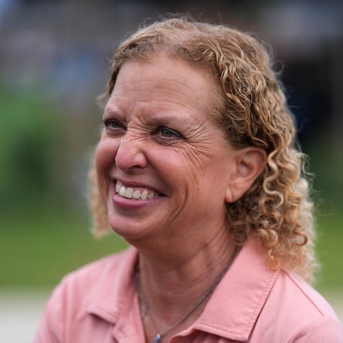 U.S. Rep. Debbie Wasserman Schultz smiles as she greets constituents at a National Night Out community event while campaigning for Florida's 20th congressional district, in Plantation, Fla., Tuesday, Aug. 4, 2026. (AP Photo/Rebecca Blackwell)