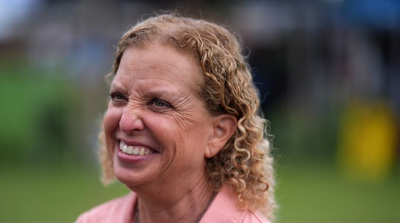 U.S. Rep. Debbie Wasserman Schultz smiles as she greets constituents at a National Night Out community event while campaigning for Florida's 20th congressional district, in Plantation, Fla., Tuesday, Aug. 4, 2026. (AP Photo/Rebecca Blackwell)