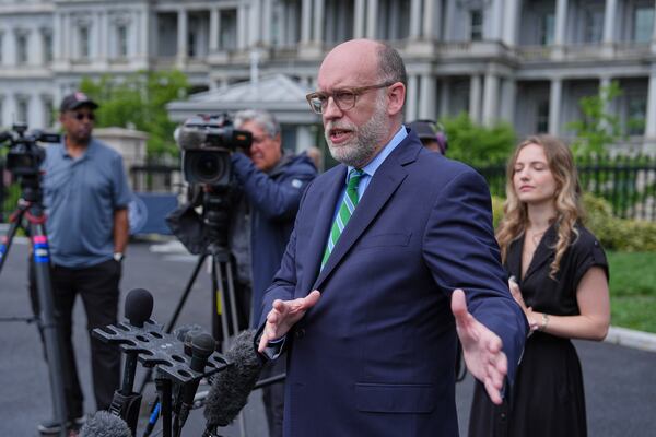 Office of Management and Budget Director Russell Vought speaks to reporters at the White House, Thursday, May 22, 2025, in Washington. (AP Photo/Evan Vucci)