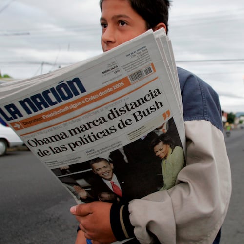 FILE - A vender sells La Nation newspapers in San Jose, Jan. 21, 2009. (AP Photo/Kent Gilbert, File)
