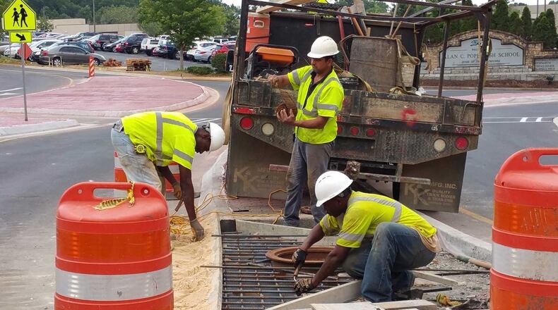Crews working on day three of classes to finish the roundabout outside Pope High School, which opened the day before classes started, the transportation agency said.
